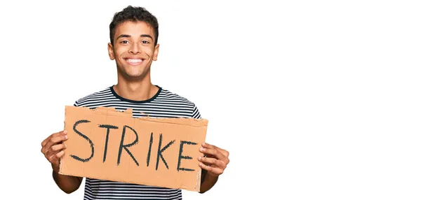Young Handsome African American Man Holding Strike Banner Cardboard Looking — Stock Photo, Image