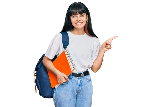 Menina Hispânica Jovem Usando Mochila Estudantil Segurando Livro Sorrindo Feliz — Fotografia de Stock