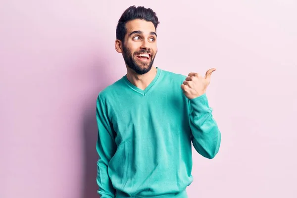 Young Handsome Man Beard Wearing Casual Sweater Pointing Thumb Side — Stock Photo, Image