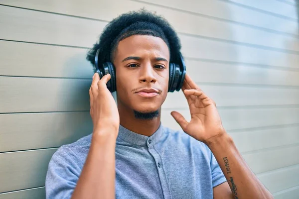 Young African American Man Unhappy Expression Listening Music Using Headphones — Stock Photo, Image