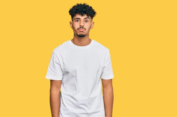 Jovem Árabe Homem Vestindo Casual Branco Shirt Soprando Bochechas Com — Fotografia de Stock