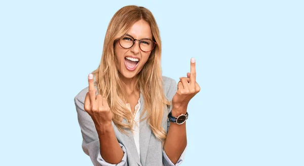 Beautiful Blonde Young Woman Wearing Business Clothes Showing Middle Finger — Foto Stock