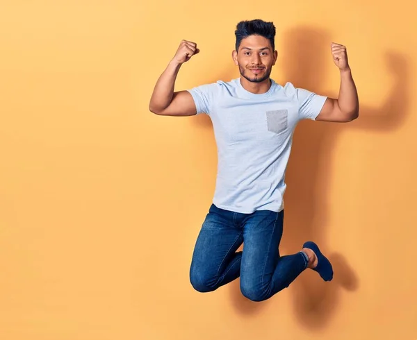 Young Handsome Latin Man Wearing Casual Clothes Smiling Happy Jumping — Stock Photo, Image