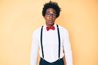 Handsome african american man with afro hair wearing hipster elegant look depressed and worry for distress, crying angry and afraid. sad expression. 