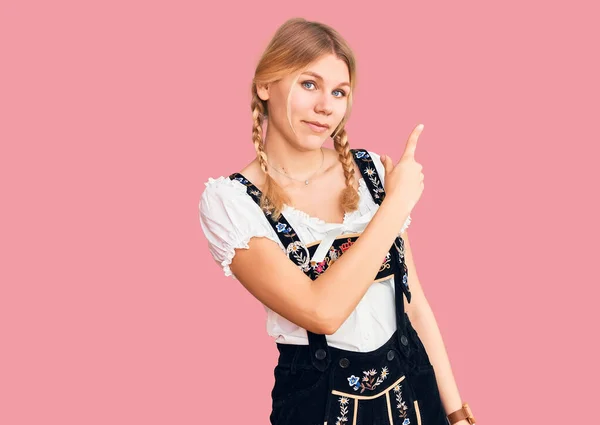 Young Beautiful Blonde Woman Wearing Oktoberfest Dress Pointing Hand Finger — Foto de Stock