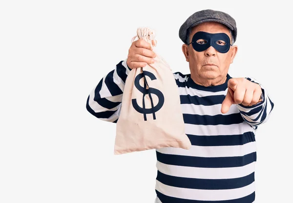 Senior Handsome Man Wearing Burglar Mask Holding Money Bag Pointing — Stock Photo, Image