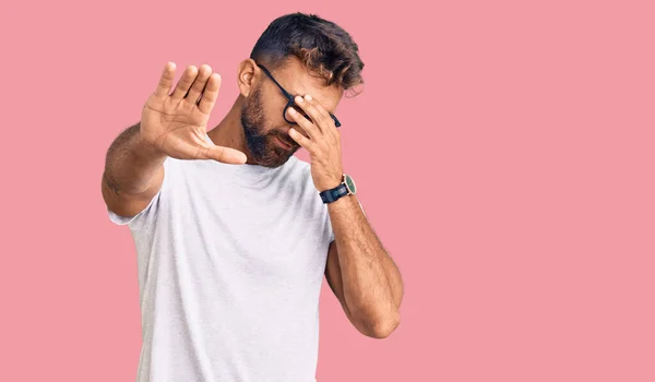 Young Hispanic Man Wearing Casual Clothes Glasses Covering Eyes Hands — Stock Photo, Image