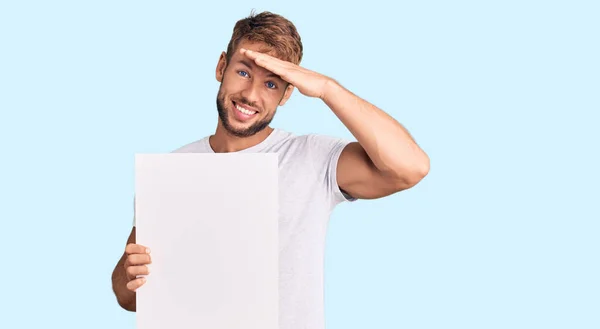 Young Caucasian Man Holding Blank Empty Banner Stressed Frustrated Hand — Stok fotoğraf