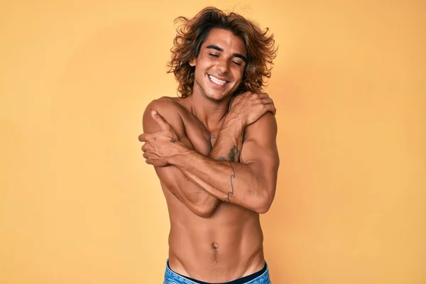 Young Hispanic Man Standing Shirtless Hugging Oneself Happy Positive Smiling — Stock Fotó