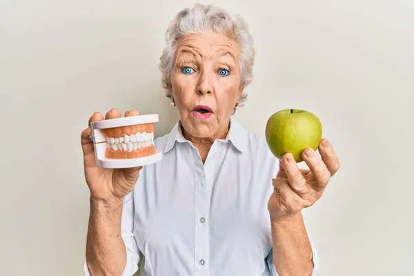 Senior Grey Haired Woman Holding Green Apple Denture Teeth Shock — Stock Photo, Image