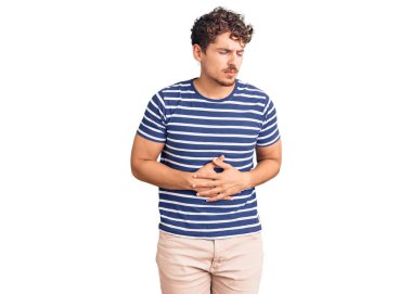 Kıvırcık saçlı, eli karnında sıradan kıyafetler giyen genç yakışıklı bir adam. Çünkü hazımsızlık, acı verici bir hastalık ve kendini iyi hissetmiyor. Ağrı kavramı. 