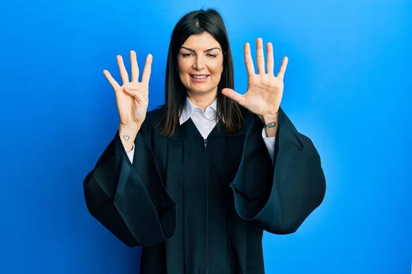 Young Hispanic Woman Wearing Judge Uniform Showing Pointing Fingers Number — Stock Photo, Image