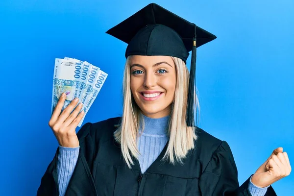 Beautiful Blonde Woman Wearing Graduation Cap Ceremony Robe Holding Hungarian — Stock Photo, Image