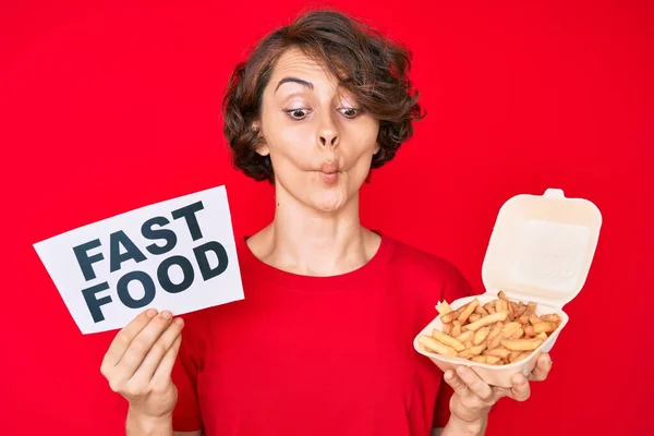 Young Hispanic Woman Holding Potato Chip Fast Food Banner Making — Stock Photo, Image