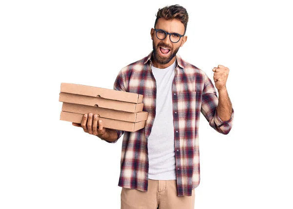 Young Hispanic Man Holding Delivery Pizza Box Screaming Proud Celebrating — Stock Photo, Image