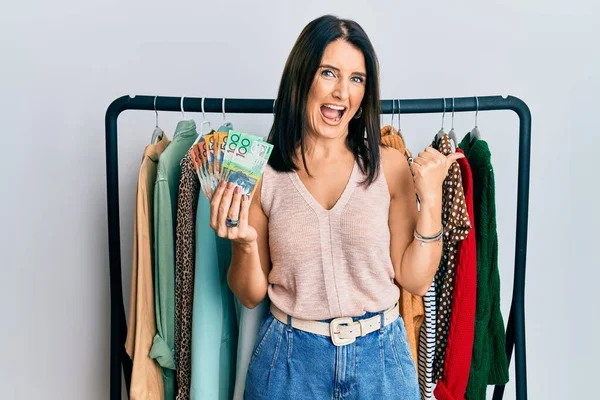 Middle Age Brunette Personal Shopper Woman Holding Australian Dollars Pointing — Stock Photo, Image