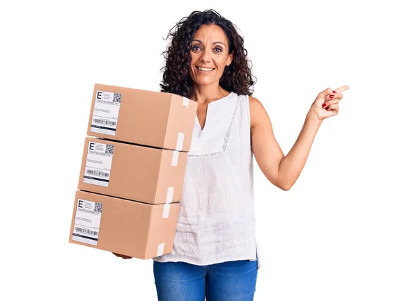 Middle Age Beautiful Woman Holding Delivery Package Smiling Happy Pointing — Stock Photo, Image