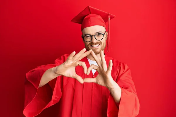 Young Redhead Man Wearing Red Graduation Cap Ceremony Robe Smiling — Stock Photo, Image