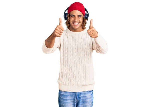 Young Hispanic Man Listening Music Using Headphones Approving Doing Positive — Stock Photo, Image