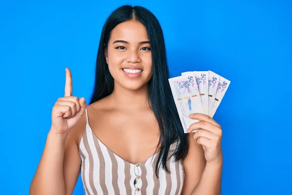 Young Beautiful Asian Girl Holding Colombian Pesos Smiling Idea Question — Stock Photo, Image