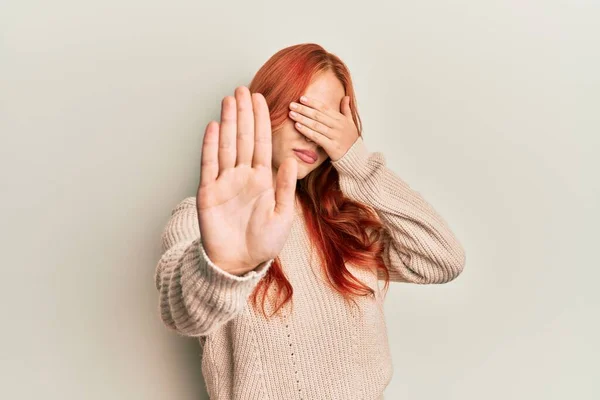 Young Beautiful Redhead Woman Wearing Casual Winter Sweater Covering Eyes — Stock Photo, Image