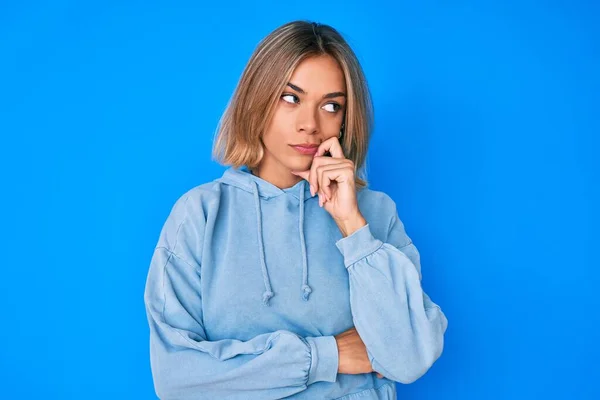 Beautiful Caucasian Woman Wearing Casual Sweatshirt Serious Face Thinking Question — Stockfoto