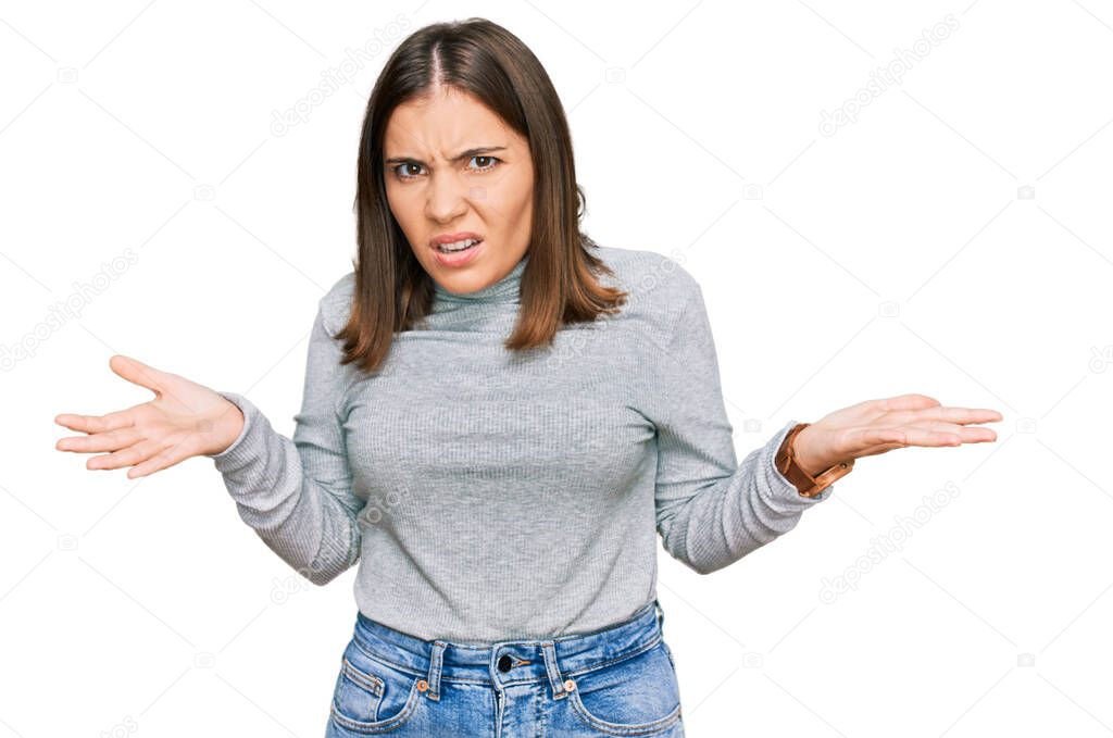 Young beautiful woman wearing casual turtleneck sweater clueless and confused with open arms, no idea concept. 