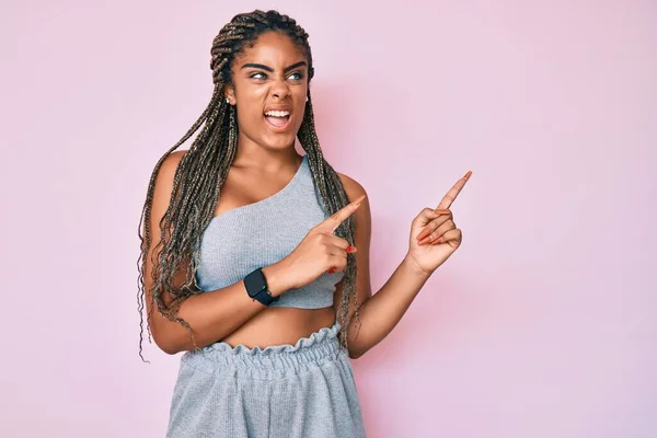 Young African American Woman Braids Wearing Sports Clothes Angry Mad —  Fotos de Stock