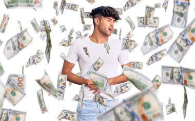 Mide bulantısı, acı verici bir hastalık yüzünden günlük giysiler giyen genç İspanyol bir adam. Ağrı kavramı.