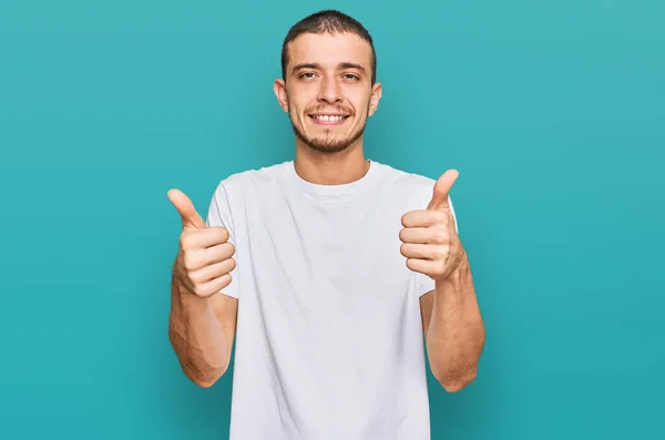 Hispanic Young Man Wearing Casual White Shirt Success Sign Doing — Fotografia de Stock