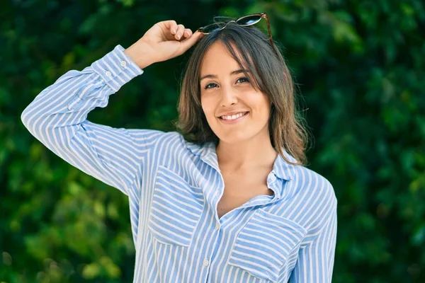 Young Hispanic Woman Smiling Happy Touching Her Sunglasses Park — Stock Photo, Image