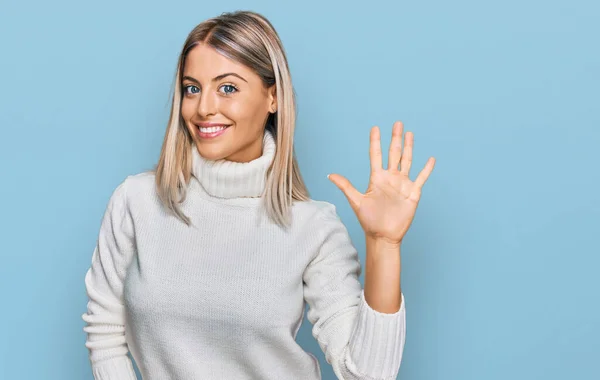 Beautiful Blonde Woman Wearing Casual Turtleneck Sweater Showing Pointing Fingers — Stock Photo, Image