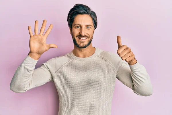 Young Hispanic Man Wearing Casual Winter Sweater Showing Pointing Fingers — Stock Photo, Image