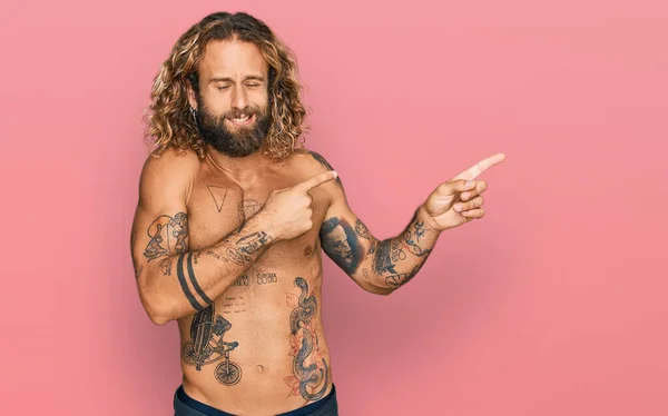 Handsome Man Beard Long Hair Standing Shirtless Showing Tattoos Pointing — Stock Photo, Image