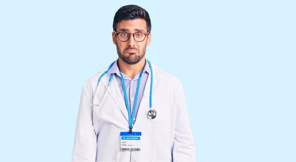 Young Hispanic Man Wearing Doctor Uniform Stethoscope Depressed Worry Distress — Stock Photo, Image