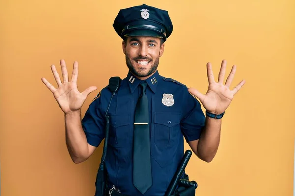 Handsome Hispanic Man Wearing Police Uniform Showing Pointing Fingers Number — 스톡 사진