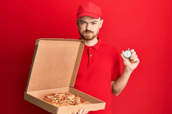 Young Redhead Man Wearing Delivery Uniform Holding Pizza Box Countdown — 图库照片