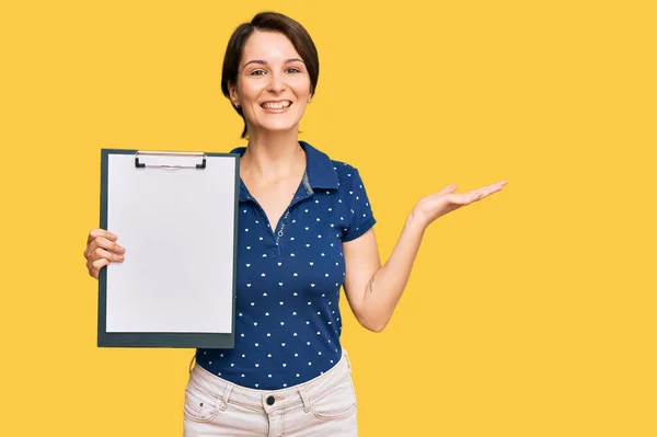 Young Brunette Woman Short Hair Holding Clipboard Blank Space Celebrating — Foto Stock