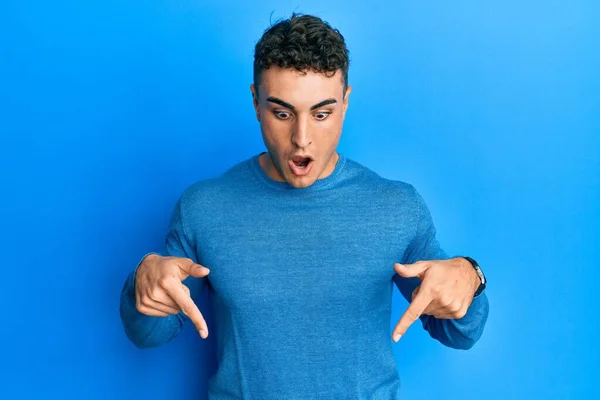 Hispanic Young Man Wearing Casual Winter Sweater Pointing Fingers Showing — Fotografia de Stock