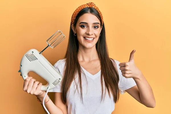 Beautiful Brunette Young Woman Holding Pastry Blender Electric Mixer Smiling — Stok fotoğraf