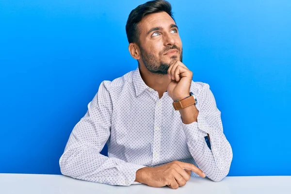 Handsome Hispanic Man Wearing Business Clothes Sitting Table Hand Chin — Stockfoto