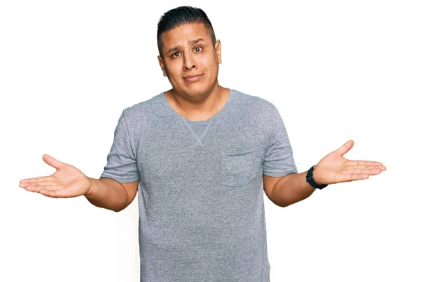 Young Latin Man Wearing Casual Clothes Clueless Confused Expression Arms — Stock Photo, Image