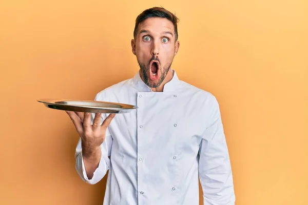 Handsome Man Beard Wearing Chef Uniform Holding Silver Tray Scared — Stock Photo, Image