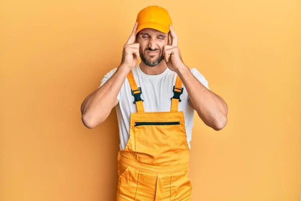 Young Handsome Man Wearing Handyman Uniform Yellow Background Hand Head — Stockfoto