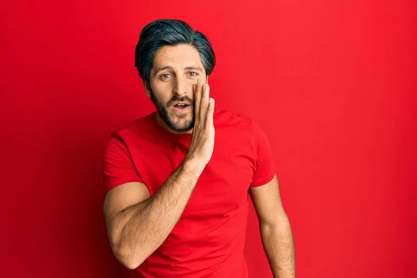 Young Hispanic Man Wearing Casual Red Shirt Hand Mouth Telling — Stock Photo, Image