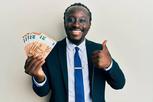 Handsome Young Black Man Wearing Business Suit Holding Euros Banknotes — Stockfoto