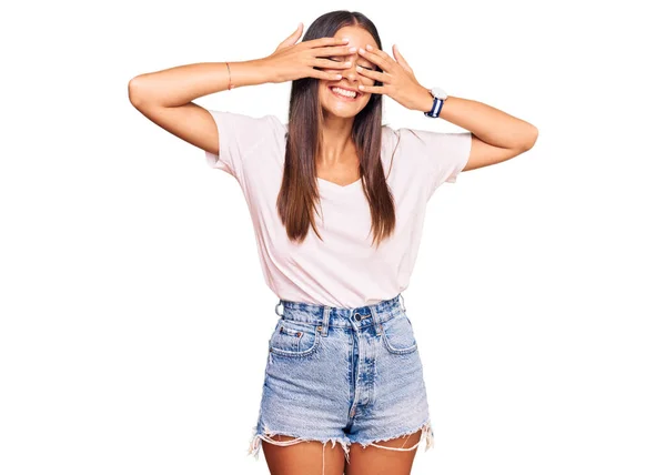Young Hispanic Woman Wearing Casual White Tshirt Covering Eyes Hands — Stock Photo, Image