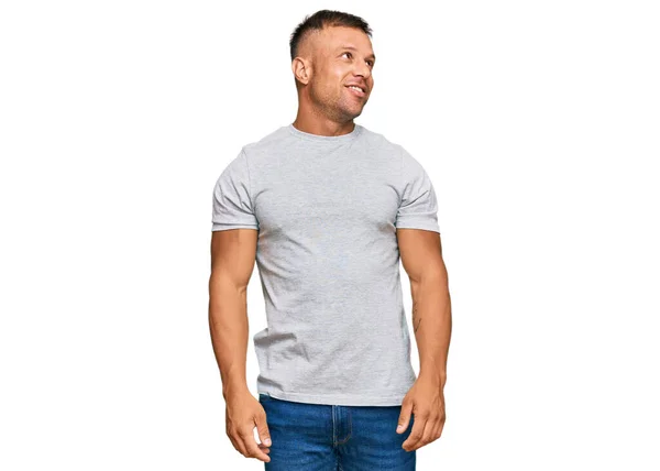 Handsome Muscle Man Wearing Casual Grey Tshirt Looking Away Side — Stock Fotó