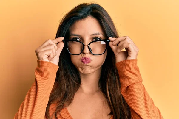 Beautiful Hispanic Woman Wearing Glasses Puffing Cheeks Funny Face Mouth — Foto de Stock