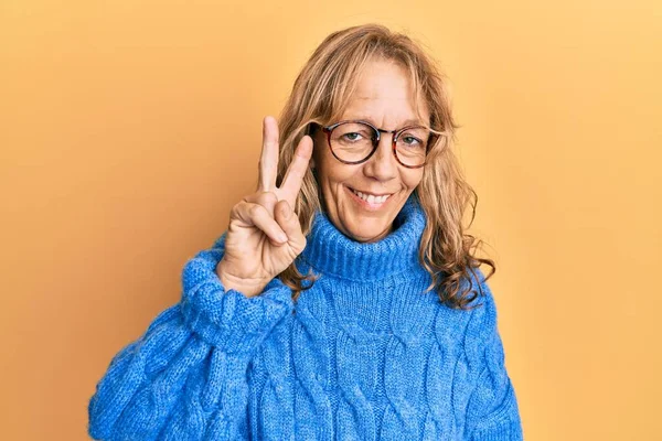 Middle Age Blonde Woman Wearing Glasses Casual Winter Sweater Showing — 图库照片